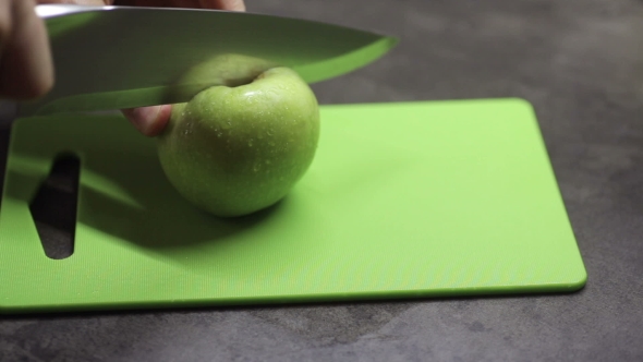Cook Cuts Apples with a Knife
