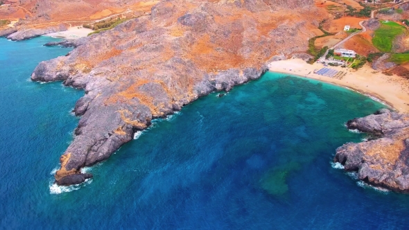 Blue Sea, Waves Breaking in Cliffs at Shore