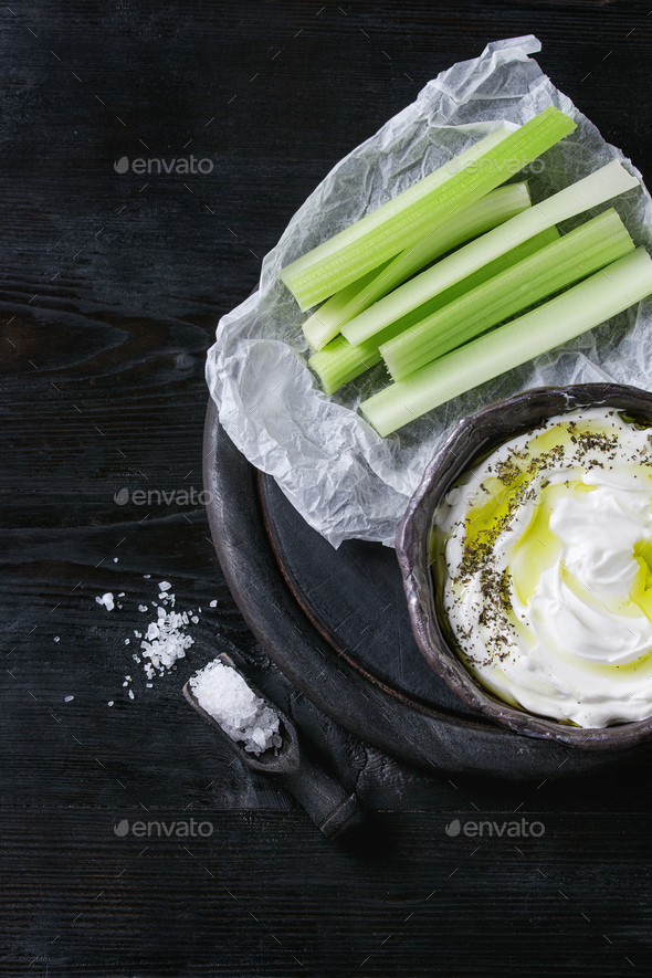 Fresh celery with yogurt dip - Stock Photo - Images