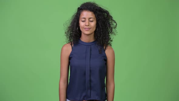 Young Beautiful Hispanic Businesswoman Relaxing alt