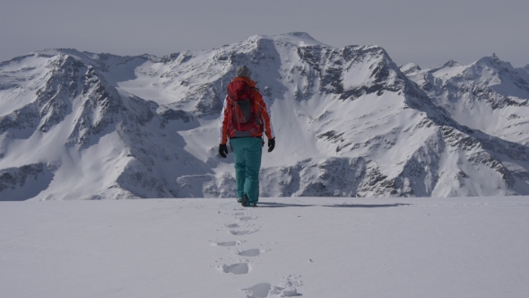 Footsteps of Woman Walking on Mountain Summit