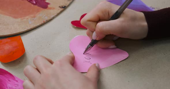 Signing Handmade Cards for Valentine's Day