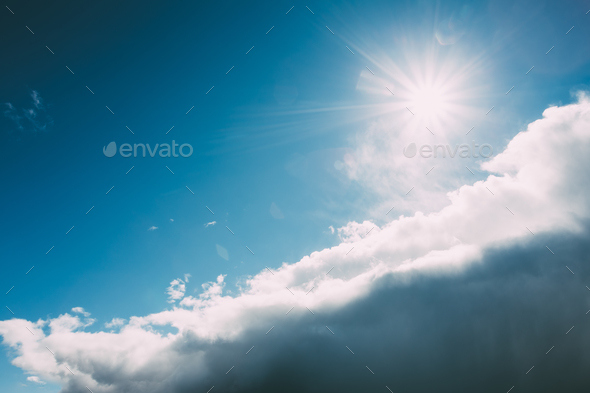Dramatic Sky, Blue And White Colors. Sun Shine Over Fluffy Cloud - Stock Photo - Images