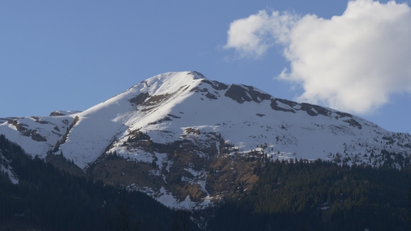 Cloud Flies Over Snowy Mountain