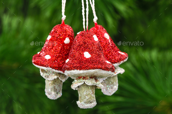 Mushrooms amanita, vintage decoration on a Christmas tree backgr - Stock Photo - Images