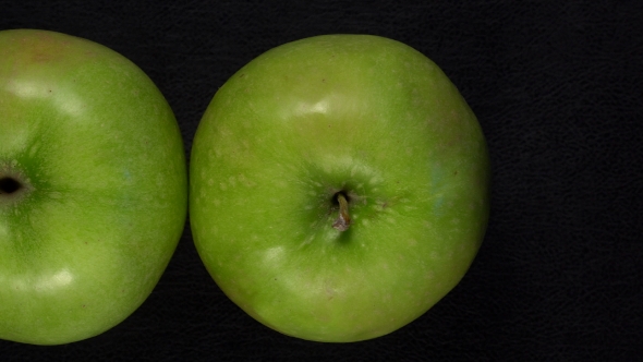 Fresh Green Apples on Black Background