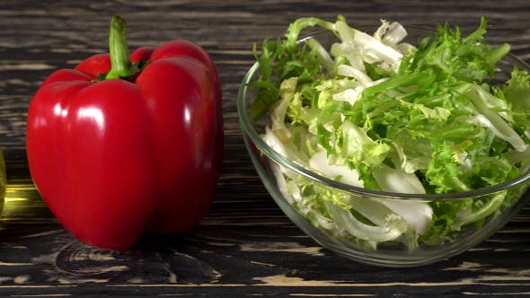 Vegetables Ingridients for Salad on Rustic Wooden Background.