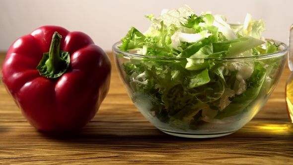 Vegetables Ingridients for Salad on Rustic Wooden Background.