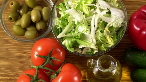 Vegetables Ingridients for Salad on Rustic Wooden Background.