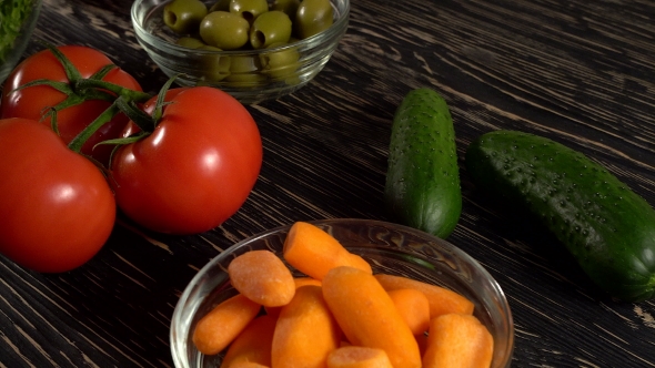 Vegetables Ingridients for Salad on Rustic Wooden Background.