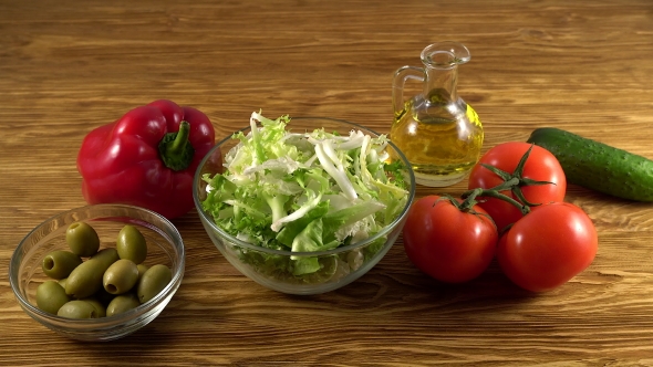 Vegetables Ingridients for Salad on Rustic Wooden Background.