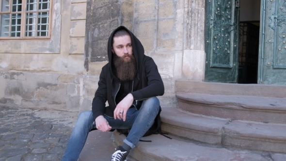 VideoHive Bearded Man Long Beard Brutal Hipster with Moustache on Serious Sits on the Steps 19784277 VideoHive Bearded Man Long Beard Brutal Hipster with Moustache on Serious Sits on the Steps 19784277