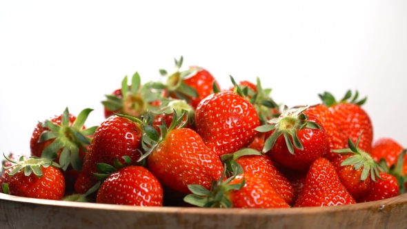 Strawberry in a Wooden Bowl Rotates on a Turntable alt