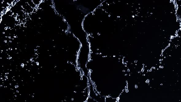 Super Slow Motion Shot of Water Splash Isolated on Black Background at 1000Fps alt