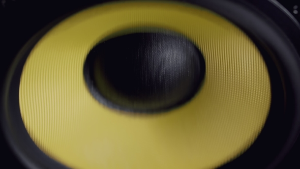 at Moving Sub-woofer. Speaker Part. Black and Yellow Colors