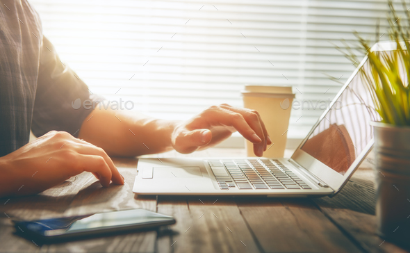 person looking to the laptop Stock Photo by choreograph | PhotoDune