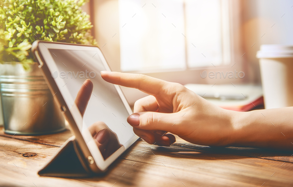 woman is working on tablet - Stock Photo - Images