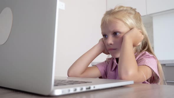 Child at home at the computer