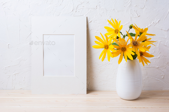 White mat frame mockup with yellow rosinweed flowers in pitcher - Stock Photo - Images