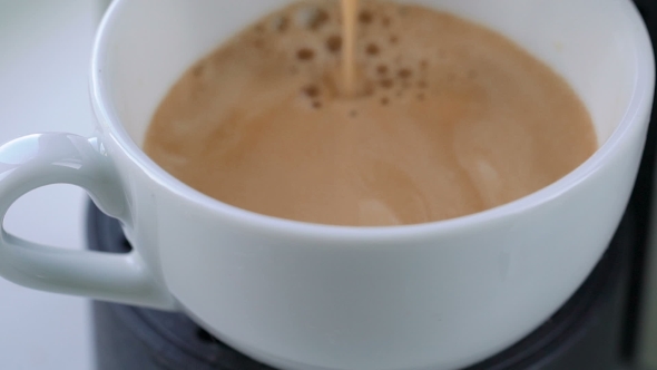 Espresso Machine Pouring Coffee in Cup