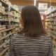 Woman Walking Along Shelves with Products - VideoHive Item for Sale