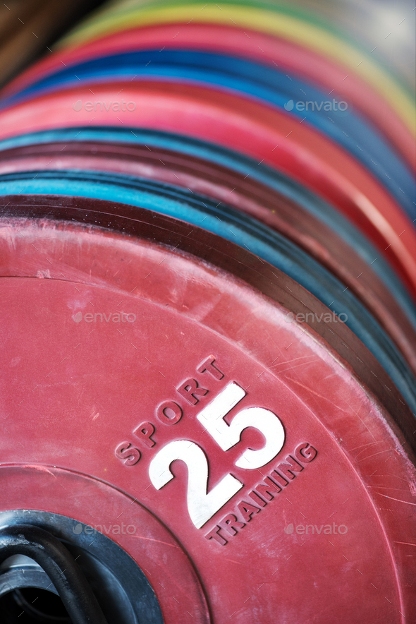 Close up on a stack of crossfit weights in a gym - Stock Photo - Images