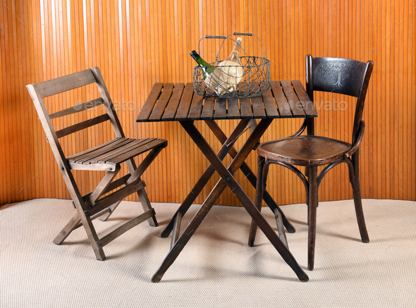 Folding Table with Chairs and Wire Basket Stock Photo by Photology75
