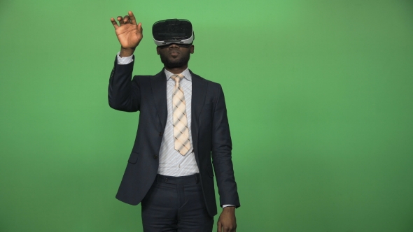 Black Man Using VR Glasses alt