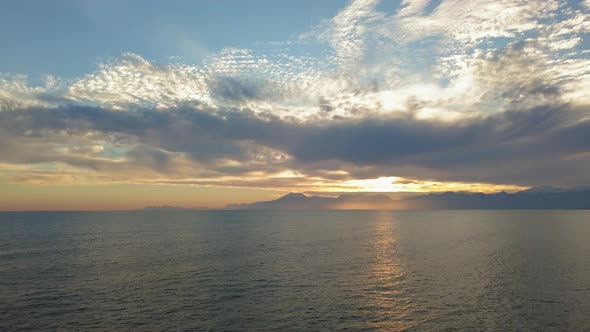 Beautiful Sunset at Beach with Golden Sun Reflection on the Sea