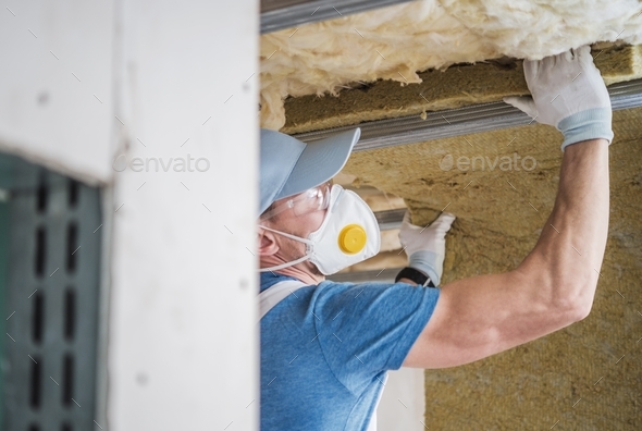 House Insulating by Worker - Stock Photo - Images