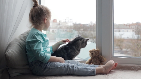 Young Girl Sitting with Cat