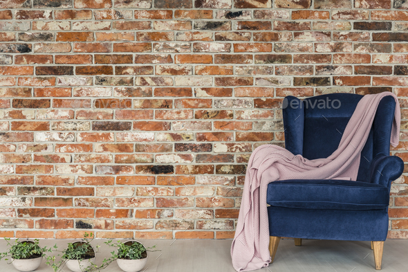 Pink blanket lying on armchair - Stock Photo - Images