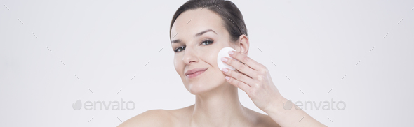Woman using a cosmetic pad
