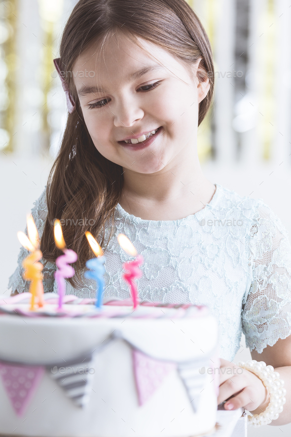 Small girl with birthday cake - Stock Photo - Images