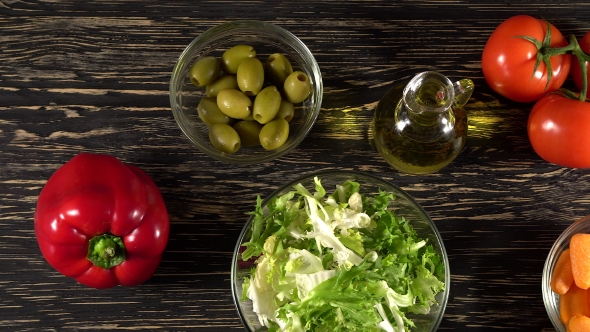 Vegetables Ingridients for Salad on Rustic Wooden Background.