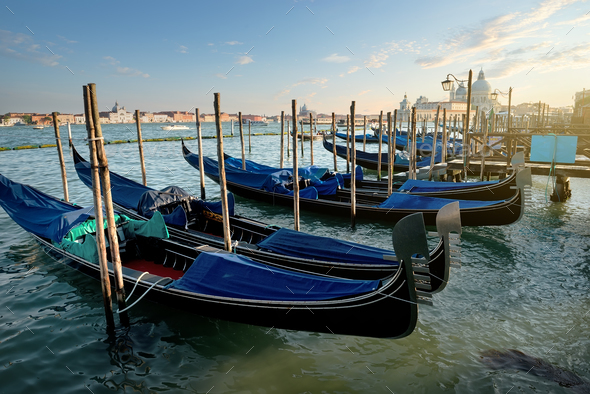 Download Venetian gondolas at sunset Stock Photo by Givaga | PhotoDune