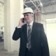 Man Walking Through Factory and Talking on Phone - VideoHive Item for Sale