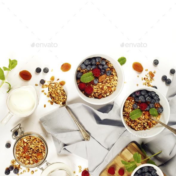 Healthy breakfast -  Homemade granola, honey, milk and berries - Stock Photo - Images