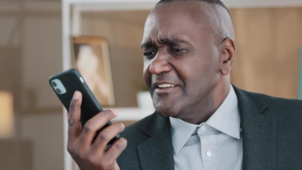 African Old Man Senior Mature Male Phone Problem Bad Hearing Confused 60s Biracial Businessman alt