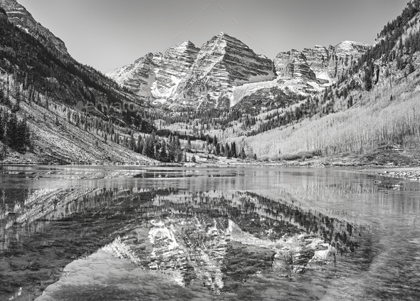 Black and white picture of Maroon Bells reflected in lake. - Stock Photo - Images
