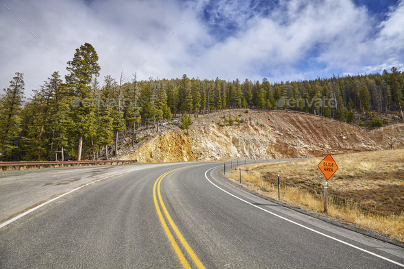 Mountain Road Curve With Slide Area Warning Sign Stock Photo By Maciejbledowski