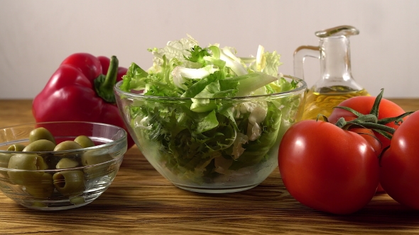 Vegetables Ingridients for Salad on Rustic Wooden Background.