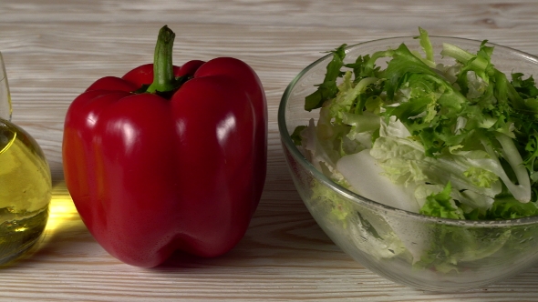 Vegetables Ingridients for Salad on Rustic Wooden Background.