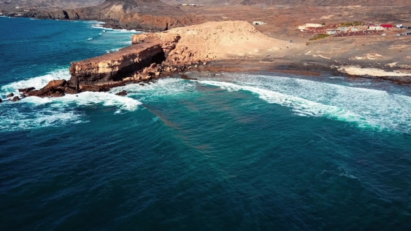 Flying Over Cliff in La Pared, Fuerteventura, Canary Islands. alt