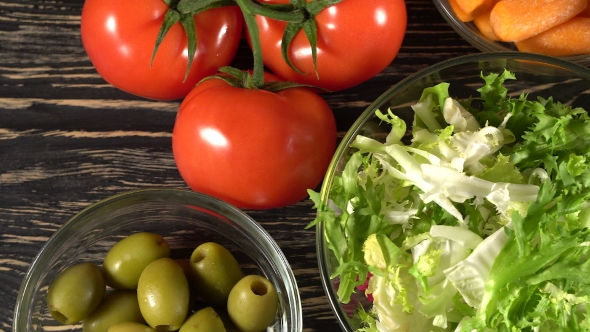 Vegetables Ingridients for Salad on Rustic Wooden Background.