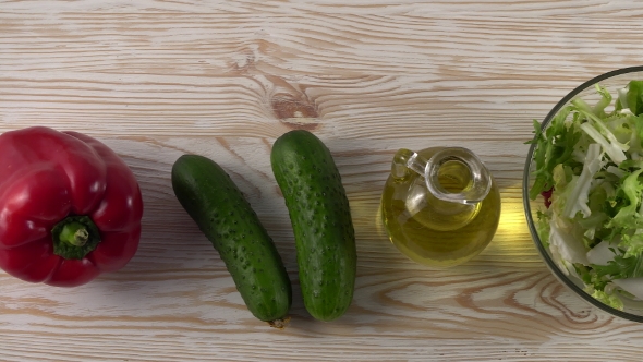 Vegetables Ingridients for Salad on Rustic Wooden Background.