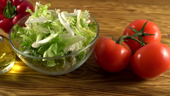 Vegetables Ingridients for Salad on Rustic Wooden Background.