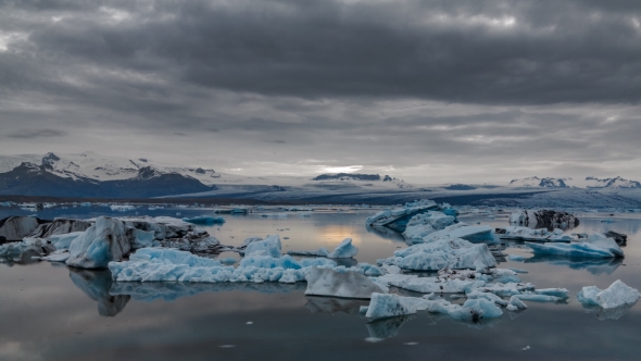 Blue Icebergs Floating Under Midnight Sun alt