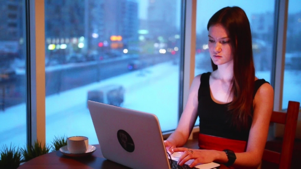 One Business Woman Working with Laptop in Cafe