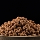 Hazelnut Rotates on a Black Background - VideoHive Item for Sale